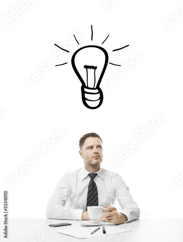 Photo: man sitting on table man sitting on table
