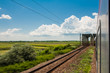 Photo: railway goes to horizon in green and yellow landscape railway goes to horizon in green and yellow landscape