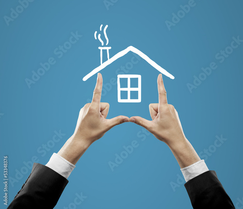 Photo: hands holding drawing roof hands holding drawing roof
