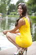 Attractive young woman in yellow dress