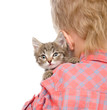 Photo: kitten peeping over the shoulder of a child. isolated on white kitten peeping over the shoulder of a child. isolated on white
