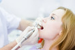 close-up medical dentist procedure of teeth polishing 