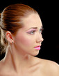 Woman eye with exotic style makeup, isolated on black background