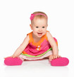 happy little baby girl in bright multicolored festive dress isol
