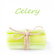 Fresh celery tied up with twine on a white background for your t