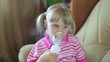 Girl makes inhalation with nebuliser