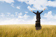 Businessman success gesture on field