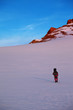 Hiker in sunrise mountains