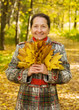 Portrait of senior woman  in autumn park