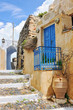 House with blue door and railing in a lane in Pyrgos