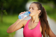 Photo: Woman drinking water from a bottle Woman drinking water from a bottle