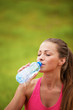 Photo: Woman drinking water from a bottle Woman drinking water from a bottle