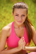 Photo: Pretty young woman doing yoga exercises Pretty young woman doing yoga exercises