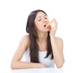 Photo: Woman enjoy sweet donut. Unhealthy junk food Woman enjoy sweet donut. Unhealthy junk food