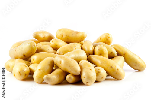 Photo: Fresh potatoes on a white background. Fresh potatoes on a white background.