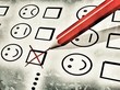 red pencil used to fill a customer satisfaction form
