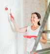  woman makes repairs at home