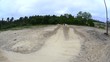 BMX biker jumping dirt jumps