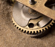 Clock gears in sand