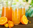 Glasses and pitcher of orange juice