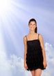 Photo: Attractive brunette girl with black dress looking up Attractive brunette girl with black dress looking up