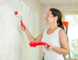 Photo: woman makes repairs at home woman makes repairs at home