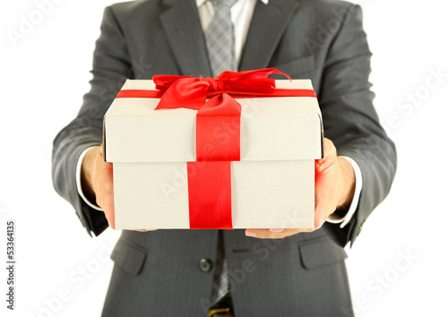 Photo: Young businessman present gift box, isolated on white Young businessman present gift box, isolated on white