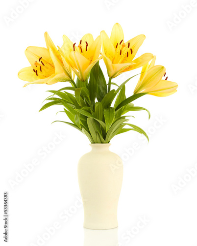 Photo: Beautiful orange lilies in vase, isolated on white Beautiful orange lilies in vase, isolated on white