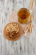 Photo: Beer in glass crunches, and nuts on napkin on wooden table Beer in glass crunches, and nuts on napkin on wooden table