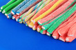 Sweet jelly candies on blue background.