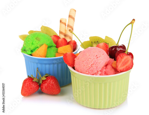 Photo: Delicious ice cream with fruits and berries in bowl isolated Delicious ice cream with fruits and berries in bowl isolated