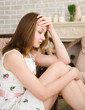 portrait of a young woman looking depressed.