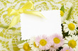 Bouquet of white and pink daisies with a card