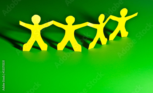 Photo: Paper people in teamworking concept Paper people in teamworking concept