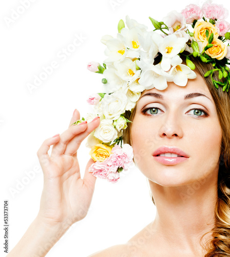 Photo: beautiful woman with flowers in her hair beautiful woman with flowers in her hair