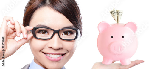 Photo: business woman and pink piggy bank business woman and pink piggy bank