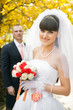 bride with out of focus groom in the background