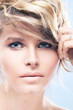 beautiful blonde woman with blond curly hair and blue eyes