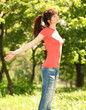 Photo: Fashion woman relaxing in the park Fashion woman relaxing in the park