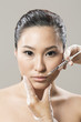 Chinese woman receiving a botox injection.