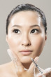 Chinese woman receiving a botox injection.