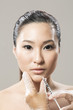 Chinese woman receiving a botox injection.