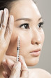Chinese woman receiving a botox injection.