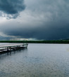 Foto: drops of rain on river under dark clouds drops of rain on river under dark clouds