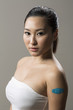 Chinese woman with Bandage on her Arm
