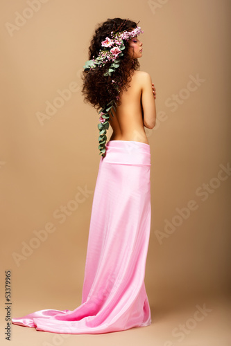 Photo: Tenderness. Gorgeous Curly Hair Brunette with Wreath of Flowers Tenderness. Gorgeous Curly Hair Brunette with Wreath of Flowers