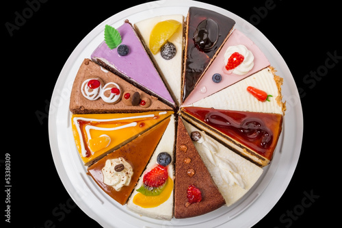 Photo: Twelve pieces of cake on black. Twelve pieces of cake on black.