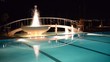 Video: Swimming pool with fountain in night illumination Swimming pool with fountain in night illumination