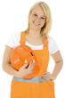 Photo: Freundliche Bauarbeiterin hält orangen Bauhelm Freundliche Bauarbeiterin hält orangen Bauhelm