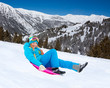 Sliding on sled from the mountain slope